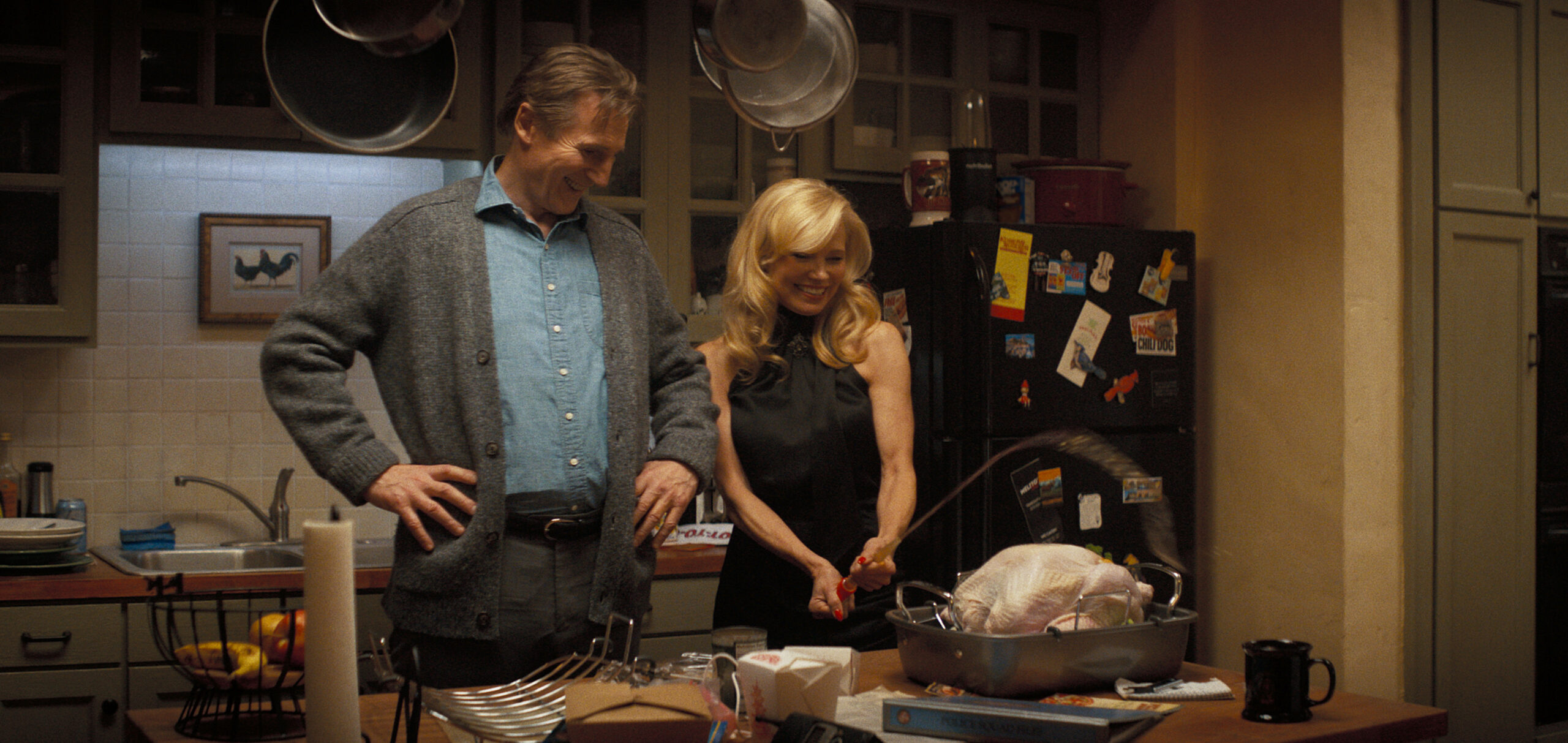 Pamela Anderson plays Beth and Liam Neeson plays Frank in The Naked Gun from Paramount Pictures.