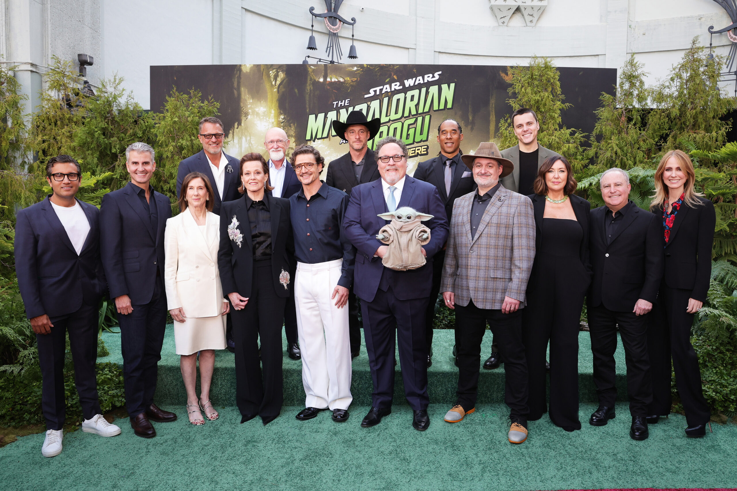 (L-R) Asad Ayaz, Chief Marketing and Brand Officer, The Walt Disney Company, Josh D'Amaro, Chief Executive Officer, The Walt Disney Company, Kathleen Kennedy, President, Lucasfilm, Steve Blum, Sigourney Weaver, Ian Bryce, Pedro Pascal, Brendan Wayne, Jon Favreau, Lateef Crowder, Dave Filoni, President & CCO, Lucasfilm, Noah Kloor, Lynwen Brennan, Alan Bergman, Chairman, Disney Entertainment and Dana Walden, President and Chief Creative Officer, The Walt Disney Company, attend The Mandalorian and Grogu Los Angeles World Premiere in Los Angeles, California on May 14, 2026.. (Frank Micolleta for Disney)